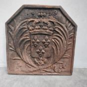 A heavy cast iron fireback decorated with the coat of arms of France and dated 1639. H.60 W.58 D.3.