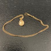 A 1920s 10ct yellow metal fob chain and pendant with impressed Fogel marks. Weight: 5.77g