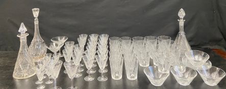 A part suite of Art Deco style cut crystal glasses, bowls and matching decanter along with two other