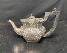A Victorian silver teapot of hexagonal form with gadrooned and repousse decoration by Ahronsberg