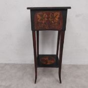 An early 20th century occasional table or plant stand with square hinged lid over the hand painted