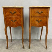 A pair of 19th century French walnut bedside tables each with serpentine fronted marble top over two