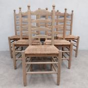 A set of six limed oak ladder back dining chairs with rush seats on stretchered supports. Seat H.