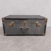 A vintage locking travelling trunk with key. H.30 W.69 D.36cm