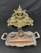 A brass desk stand fitted with inkwells and a similar copper example. L28 H.19 D.17cm