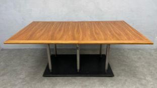 A large and impressive contemporary extending dining table having a figured applewood top with two
