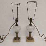 A near pair of 19th century whale oil table lamps (converted for electricity) each having a ribbed