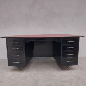 A retro styled black painted pedestal desk, the tapering surface inset with leather. H.75 W.167 D.