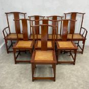 A set of eight Chinese Huanghuali yokeback or lamphanger dining chairs including two carvers each