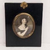 An early 20th century miniature print, portrait of Charlotte Oliver, in a gilt metal and ebonised