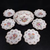 A 19th century hand painted and gilt Dresden porcelain centrepiece bowl of shell form with scalloped
