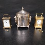 Two brass carriage clocks and a silver plated wine cooler. H.23 Dia.16.5cm ice bucket.