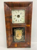 A late 19th century rosewood cased American style wall clock. 76x43cm.