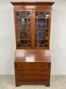 An Edwardian mahogany bureau bookcase having a moulded cornice over astragal glazed doors
