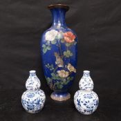 A large Japanese Meiji period (1868-1912) baluster form cloisonne vase together with a pair of