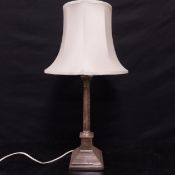 An English hallmarked silver table lamp in the form of a Corinthian column with silk lamp shade. H.