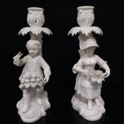 A pair of mid 19th century Blanc-de-Chine candlesticks with figural stems by Stevenson and Hancock