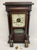 A late 19th century mahogany cased American wall clock. 67x41cm.