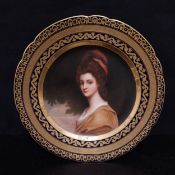 A 19th century gilt and cobalt Royal Vienna porcelain cabinet plate with central portrait of Lady