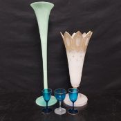A 19th century glass epergne, a later art glass example and three small coloured glasses. H.58 Dia.