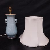 A Chinese style crackle glazed table lamp of baluster form with original silk shade. H.37cm