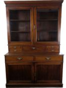 A 19th century mahogany library bookcase in two sections, the upper with glazed doors enclosing