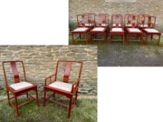 A set of ten Chinese lacquered hardwood dining chairs with drop-in upholstered seats to include