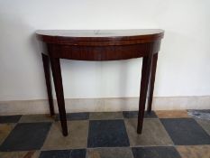 An early 20th century Georgian style demi-lune card table with foldover top on gateleg action