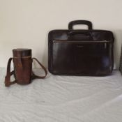 An Aspinal of London leather briefcase and early 20th century leather cased silver plated campaign