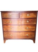 A Georgian mahogany chest of drawers on shaped bracket feet. H.101 W.107 D.54cm.