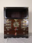 A small Korean elm cabinet with open section above panel doors with engraved lock and hinges. H.59