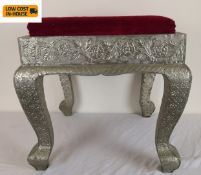 An Eastern 19th century style footstool clad in embossed metal. H.45 W.45 D.45cm.