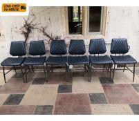 A set of six new and unused retro styled dining chairs in faux leather upholstery on tubular metal