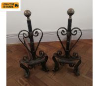 A pair of 19th century brass and iron fire dogs. H.58 L.66 cm.