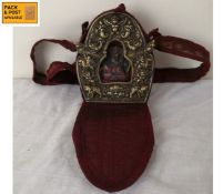 A small Tibetan travelling Gau or Ghau shrine box in repousse metal case decorated with auspicious