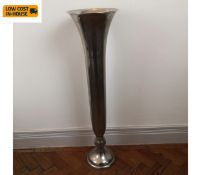 A floor standing chrome trumpet form vase. H.100cm.