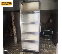 A vintage Globe Wernicke style metal bookcase on large braked casters. H.220 W.84 D.33cm. (In five