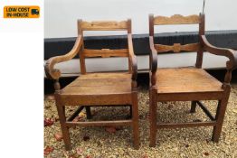 A near pair of 19th century oak armchairs with panel seats on square tapering supports. H.91cm.