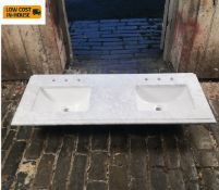 A pair of contemporary porcelain bathroom sinks inset with a marble panel. L.136 D.53cm.
