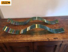 A pair of Gunta Krumins coloured art glass wall hangings. 76x8cm.