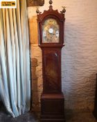 A 19th century mahogany longcase or grandfather clock having a fret cut pediment with brass Ho-Ho