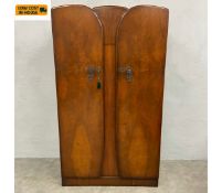 An early to mid 20th century Art Deco style walnut wardrobe with two shaped and figured quarter-