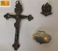 Thre items of silver viz: pill box, lapel badge and a crucifix. 9cm (Crucifix). 30g.
