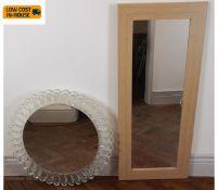 A contemporary moulded perspex wall mirror and an oak framed similar. 107x46cm. (Largest).