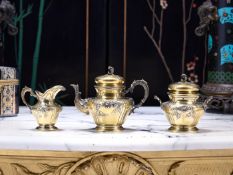A LATE 19TH CENTURY FRENCH SILVER GILT BACHELOR'S TEA SET