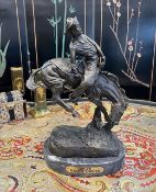 AFTER FREDERIC REMINGTON (AMERICAN,1861-1909): A BRONZE 'OUTLAW'