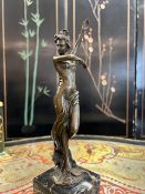 A BRONZE FIGURE OF A DANCING GIRL
