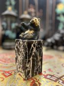 A BRONZE MODEL OF A PANDA