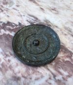 A CHINESE BRONZE MIRROR WITH SPARROWS AND FLORAL SPRAYS