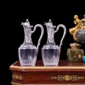 TETARD FRERES: A FINE PAIR OF 19TH CENTURY SILVER AND CRYSTAL GLASS CLARET JUGS CIRCA 1880